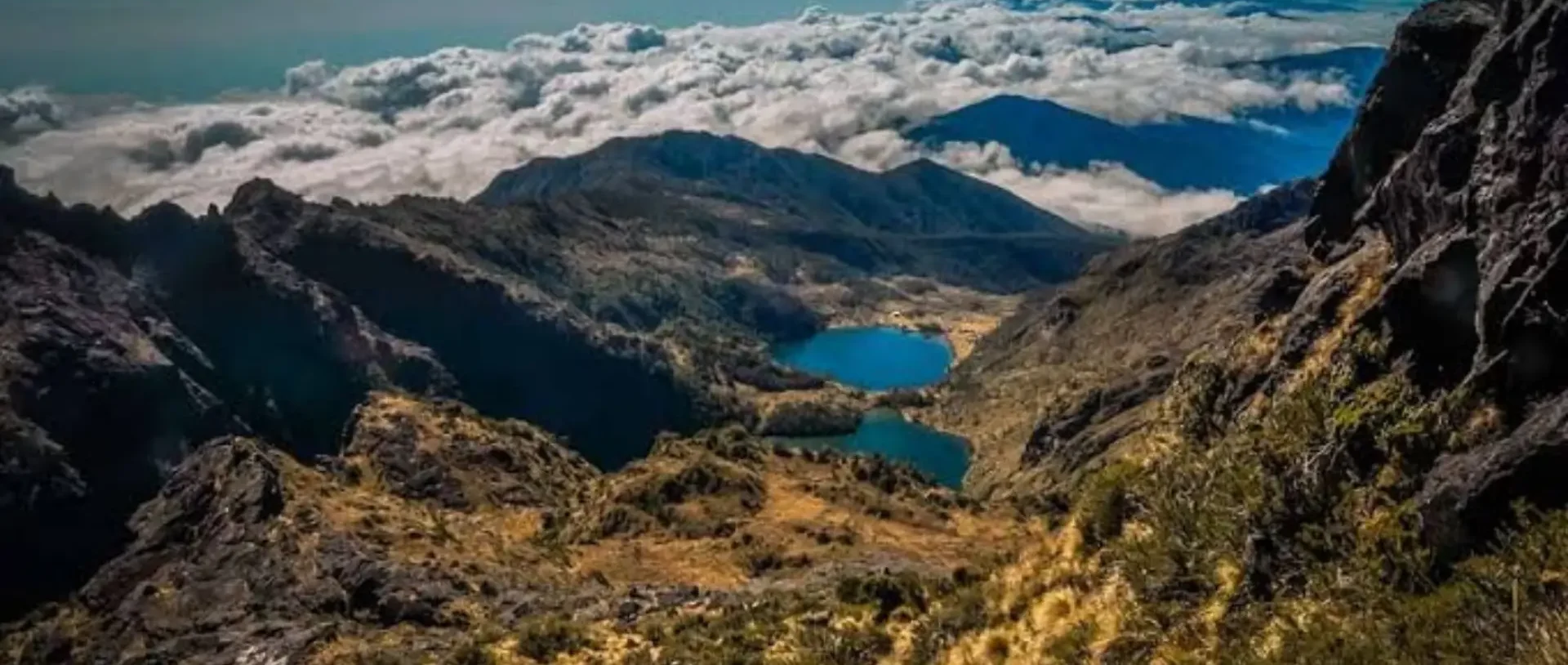 Alpine lakes and ridges above the clouds on Mt Wilhelm.