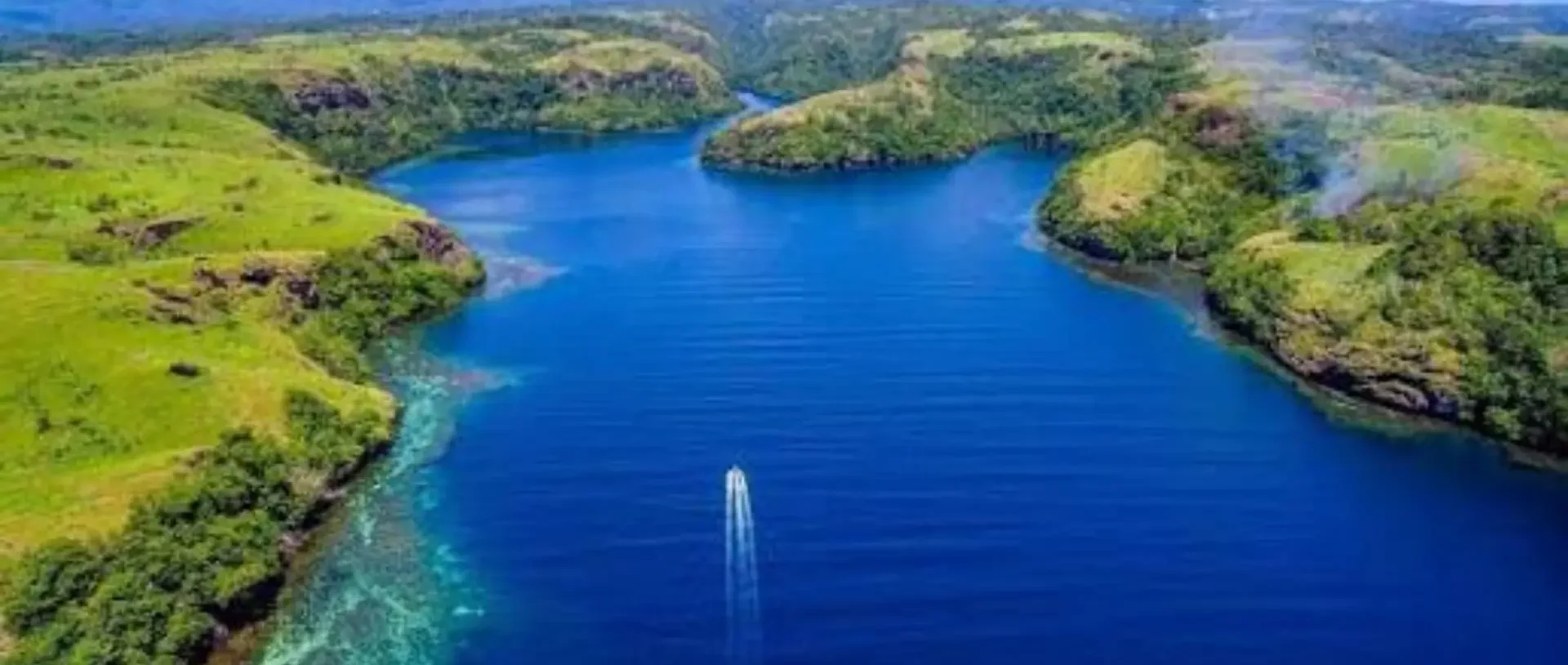 Aerial view of the deep blue Tufi fjords in Oro Province.