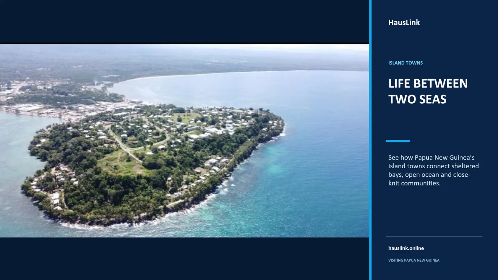 Aerial view of a Papua New Guinea island town on a headland between a sheltered bay and open ocean.
