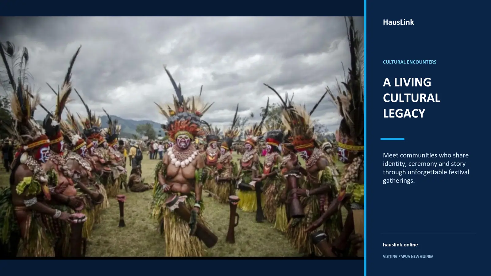 Papua New Guinean cultural group in ceremonial dress with feathered headdresses at a festival gathering.